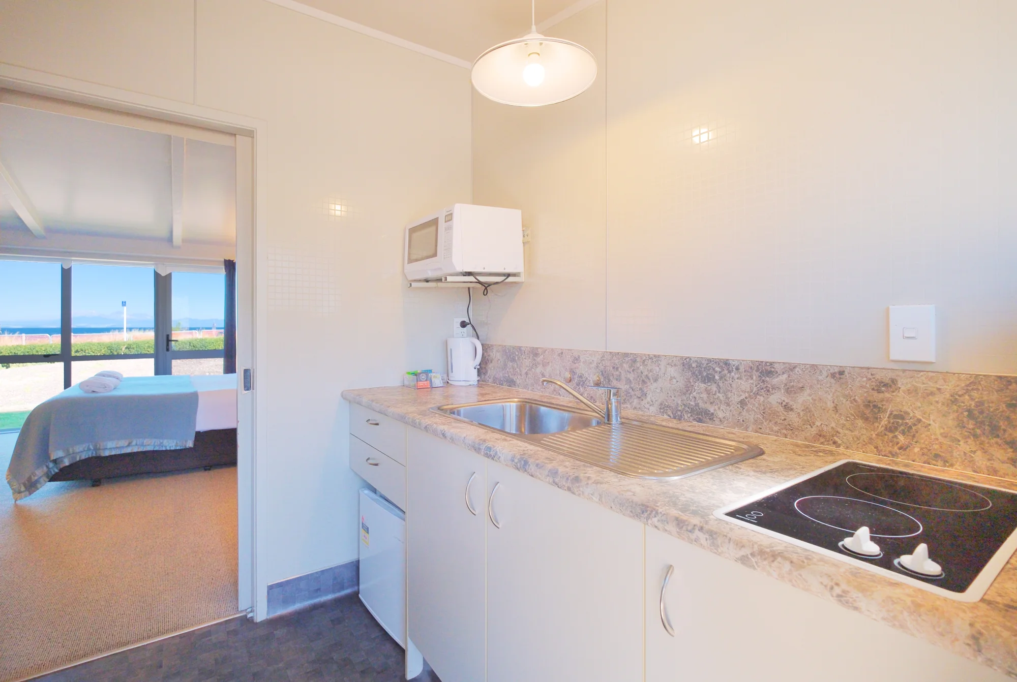 A guest-room kitchenette at Twin Peaks Lakeside Inn, Taupō