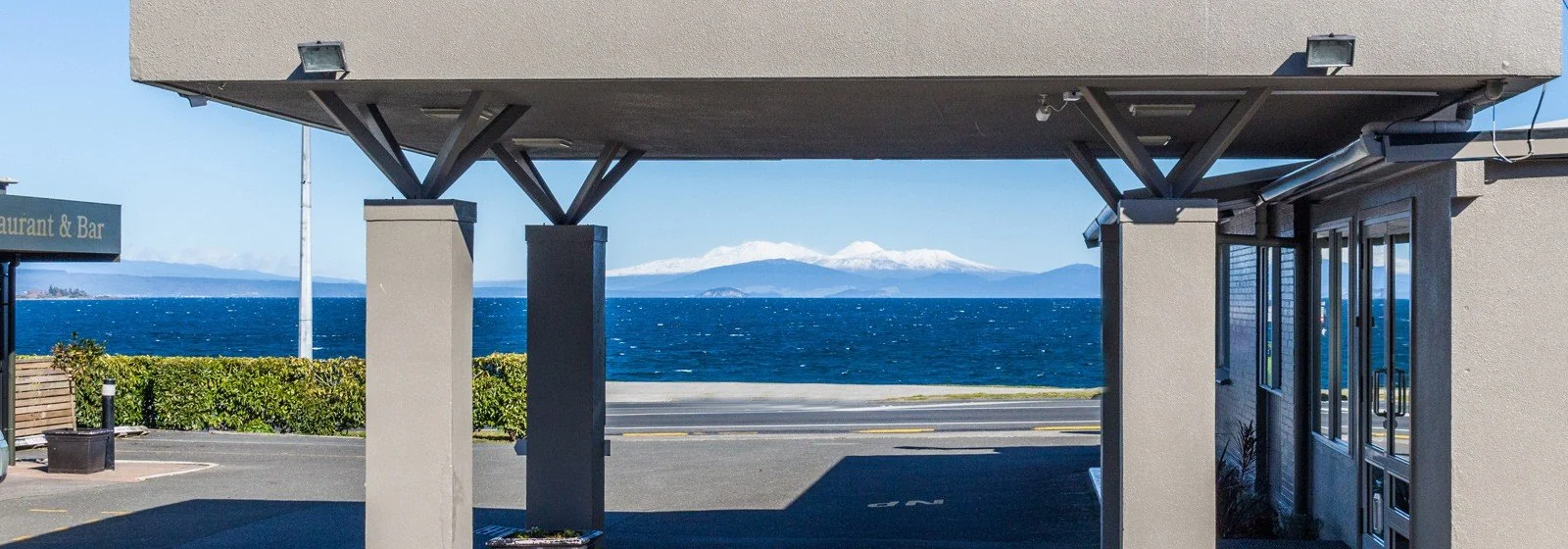 A framed view of Lake Taupō from Twin Peaks