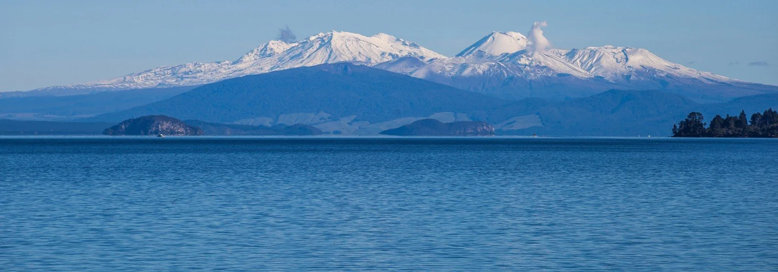 Snow-covered mountains across Lake Taupō